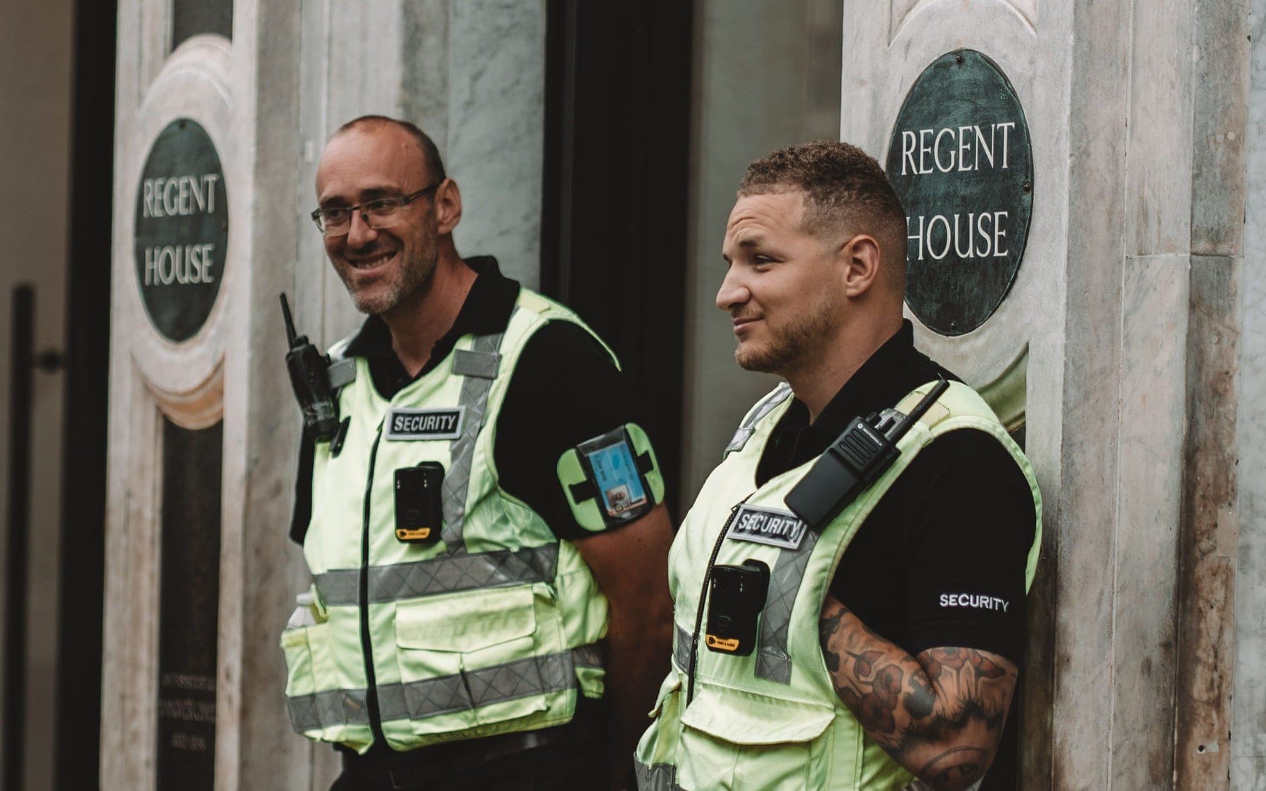 An SIA door supervisor at a venue entrance